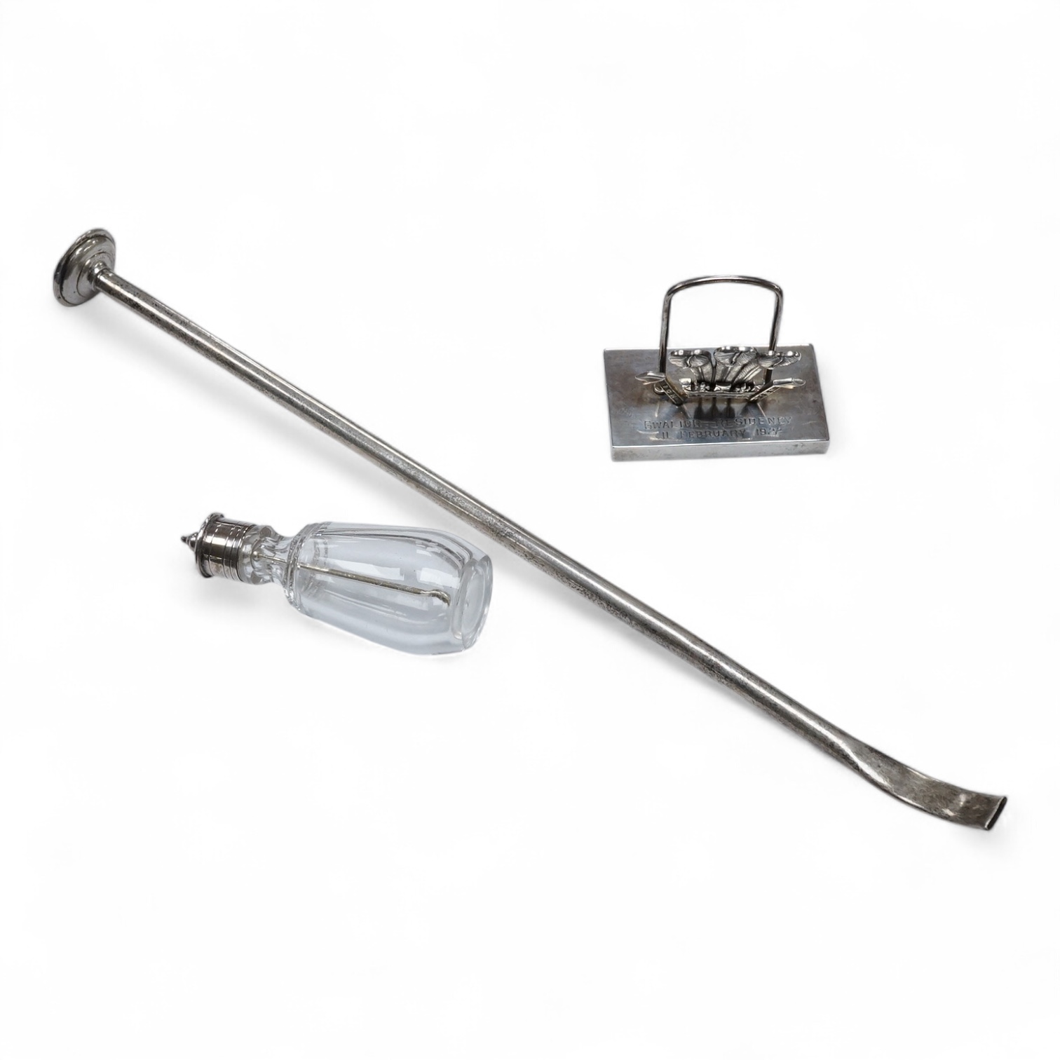 An Edwardian silver candle snuffer, possible Goldsmiths & Silversmiths Co Ltd, London, 1909, 29.9cm, a Victorian silver mounted glass cayenne pepper jar and white metal(tests as silver) menu holder, with Prince of Wales